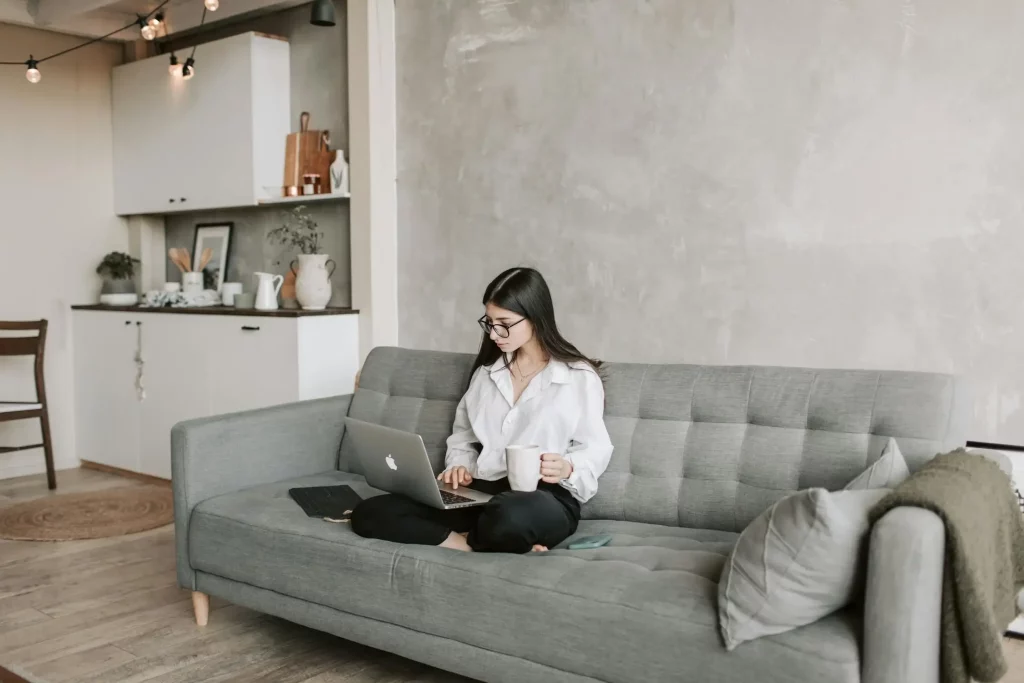 a woman is sitting while looking for a loan